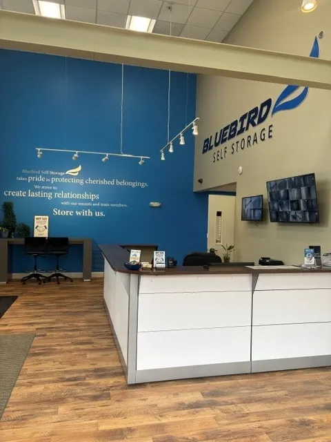 Bluebird Self Storage front desk with brand wall